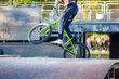 young athlete makes an extreme bike jump on a ramp