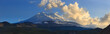 Mount Elbrus during sunset in the rays of the sun. Panoramic view of the mountain range in the North Caucasus in Russia.