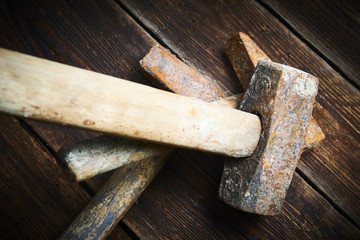 Wall Mural - Close up of tree old used hammer on a rustic wooden background. Selective focus