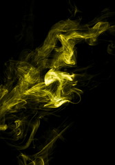 Yellow smoke on black background