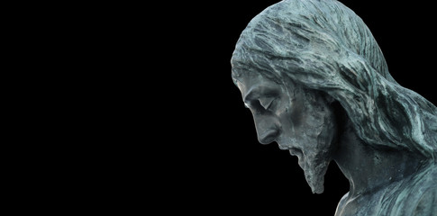 Fototapete - An ancient statue of the crucifixion of Jesus Christ in profile