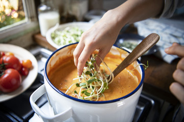 Sunflower sprouts sprinkled on a pumpkin soup