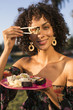 © Rawpixel.com - Woman eating sushi in the park