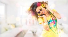 Happy Young Woman Listening Music In Headphones