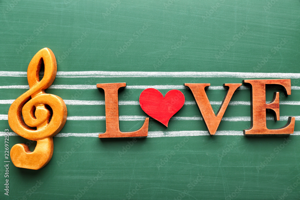 Composition with word LOVE on color background