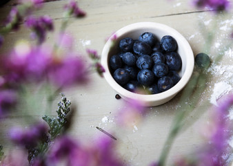 Wall Mural - Fresh blueberries in a white bowl