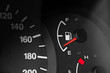 Low fuel readings on car dashboard. Horizontal photography
