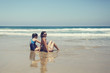 © dubova - Mother and daughter having fun to spend time together on the beach at sunset