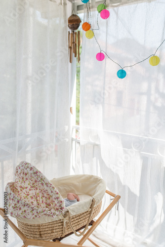 baby crib next to window