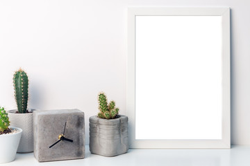 White mockup frame with cactuses and a concrete clock