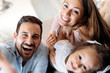 © NDABCREATIVITY - Happy family having fun time at home