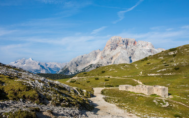 panorama with hiking trails and old ruin in foreground in south tyrol