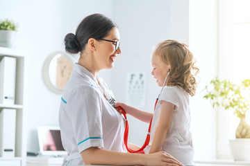 Wall Mural - Doctor examining a child