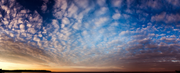 Wall Mural - Sky is in clouds at sunset