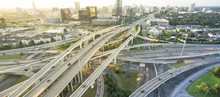 Panorama Aerial Interstate I-610 Freeway Massive Intersection And Houston Midtown Skylines Background. Stack Interchange, Elevated Road Junction Overpass Viaduct. Nightly Degree View Metropolitan Area