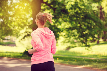 Wall Mural - fitness woman training and jogging in summer park