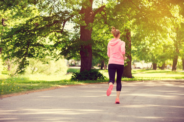 Wall Mural - fitness woman training and jogging in summer park