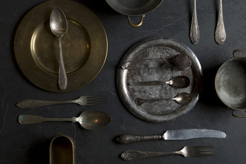 Wall Mural - Vintage kitchen utensils on a dark stone background