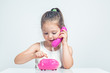 © Myst - beautiful cute little girl holding toy telephone and dialing with happy expression