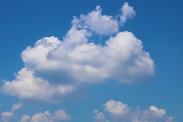 Blue clean sky with white cloud. Clouds in the blue sky.