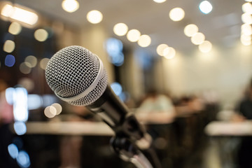 microphone over the blurred business forum meeting or conference training learning coaching room con