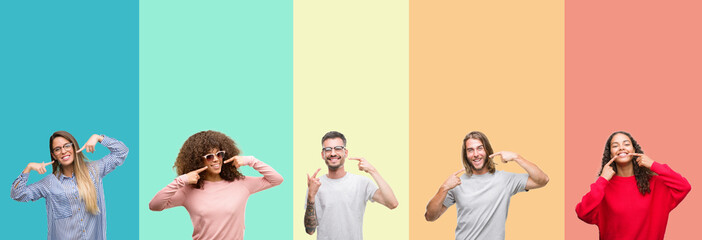 Collage of group of young people over colorful vintage isolated background smiling confident showing and pointing with fingers teeth and mouth. Health concept.