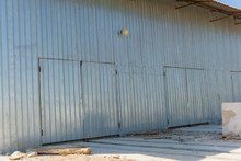 Warehouse Of Corrugated At The Factory. The Building Is Sheathed With Sheets Of Corrugated. Wall Decking On The Building
