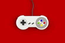 Video Game Console GamePad. Gaming Concept. Top View Retro Joystick Isolated On Red Background, 3D Rendering