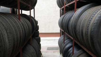 car tires in a row for sale at booth in store