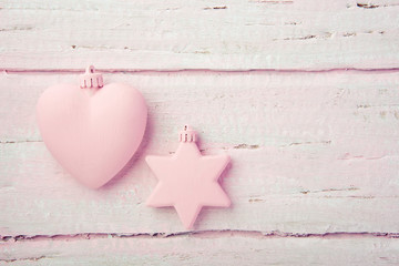 Wall Mural - New Year's Christmas toys, heart and star on a beautiful pink table