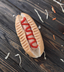 hotdog and cabbage slices on wooden background.photo with copy s