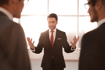 Wall Mural - businessman makes a report for the business team