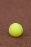 Fototapeta  - Tennis ball on a tennis clay court