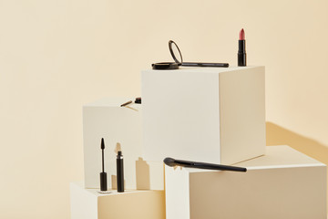 Wall Mural - various makeup supplies lying on beige cubes