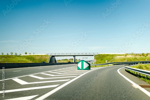 Cuadros en Lienzo French autoroute highway exit on the right with security differentiator and over