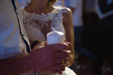 candle in hand in the dark at a wedding party