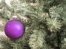Purpel Ball On Tree With Snowflakes