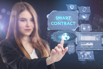 The concept of business, technology, the Internet and the network. A young entrepreneur working on a virtual screen of the future and sees the inscription: smart contract