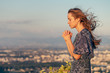 © PhotoGranary - Christian worship and praise. A young woman is praying in the evening.
