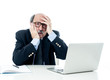 © SB Arts Media - Overwhelmed and tired old businessman working with laptop feeling angry at office