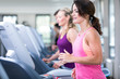 © Merpics - young beautiful woman are doing her sport running workout in the gym on a treadmill