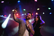 © nagaets - Couple take a selfie with a mobile in the night celebration