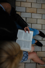 Top view image of two lesbian girls reading book together. Samesex love cincept,