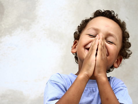 little boy praying to god stock photo