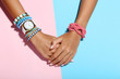 © 5second - Female hands with bracelets on colorful background