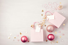 Flat Lay Of Morden Minimalist Christmas Gifts And Wooden Christmas Decoration In Pink Pastel Colors