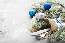 Kitchen Cutlery With Christmas Decorations On Wooden Table