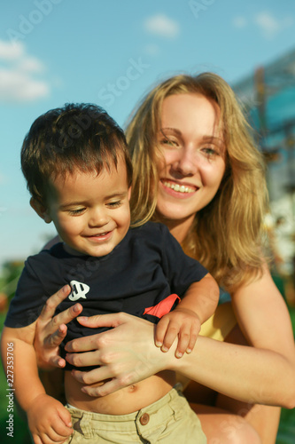Fotografie, Obraz Happy young woman with smiling positive little boy