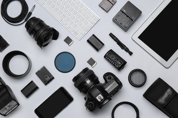 Wall Mural - flat lay composition with equipment for professional photographer on white background