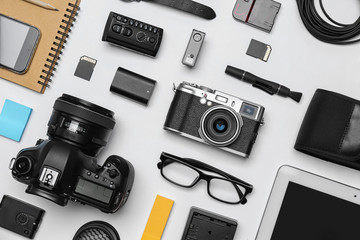 Wall Mural - flat lay composition with equipment for professional photographer on white background